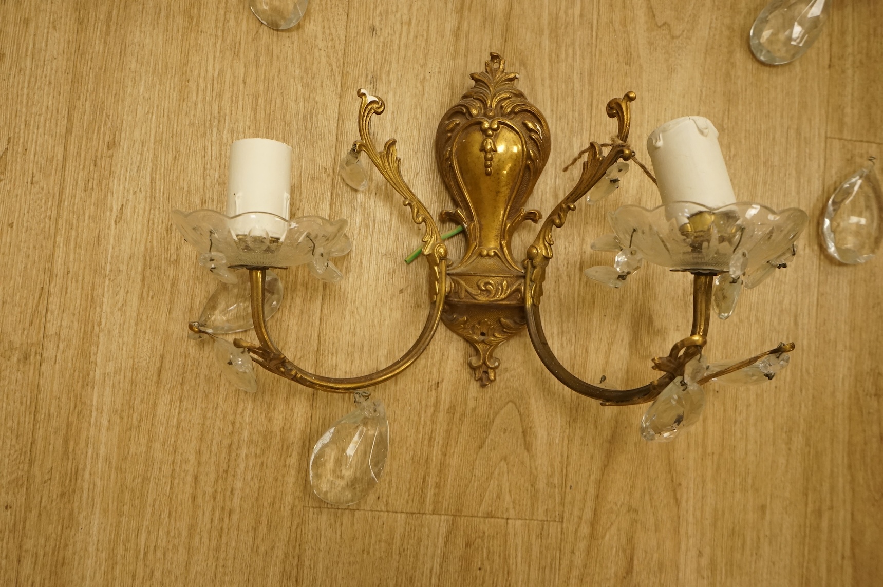 Five cast brass and glass wall lights